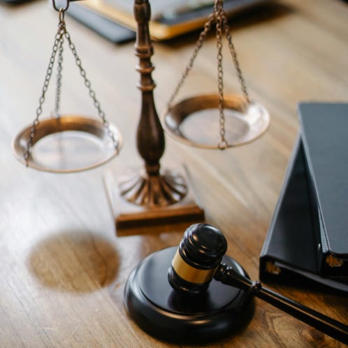 Judges desk with gavel and scales